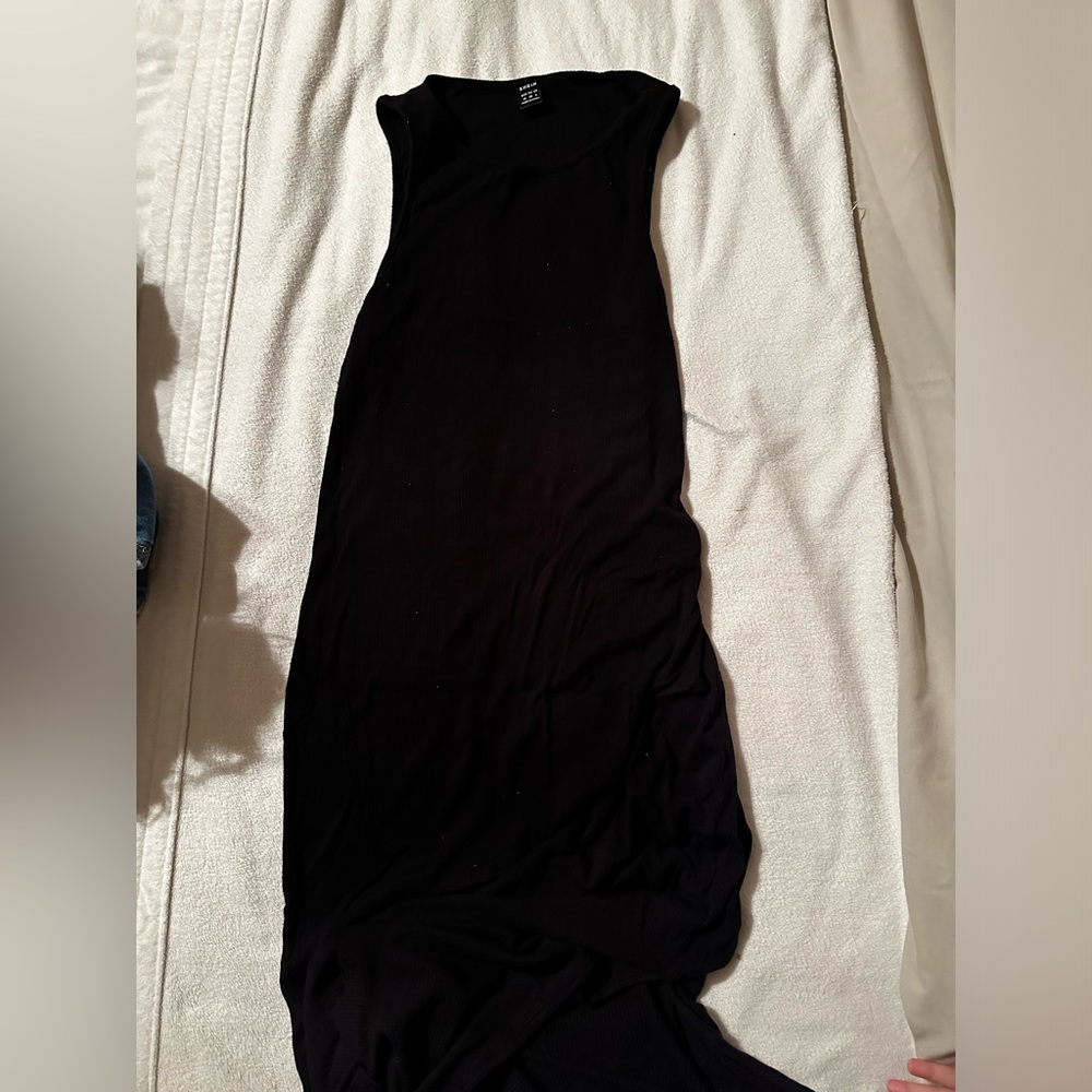 Black tight fitting SHEIN dress with leg slit